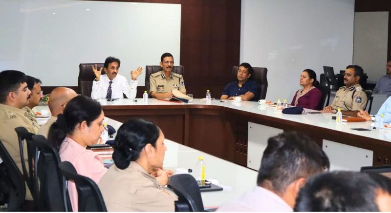 Officers with eyes closed during a guided hypnotherapy session led by Dr. Singhvi